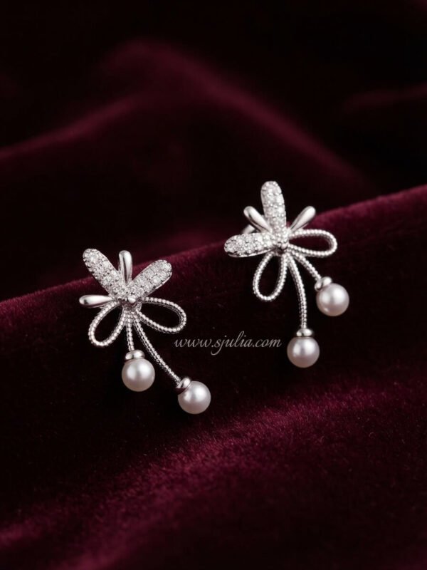 Reyna – Gold Pearl Drop Bow Studs Reyna – Gold Pearl Drop Bow Studs