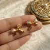 Nira – Gold Baguette Crystal Bow Studs Nira – Gold Baguette Crystal Bow Studs
