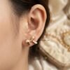 Nira – Gold Baguette Crystal Bow Studs Nira – Gold Baguette Crystal Bow Studs