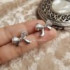 Nira – Gold Baguette Crystal Bow Studs Nira – Gold Baguette Crystal Bow Studs