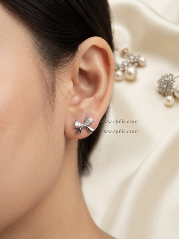 Nira – Gold Baguette Crystal Bow Studs Nira – Gold Baguette Crystal Bow Studs
