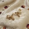 Farida – Gold Pearl Lace Bow Studs Farida – Gold Pearl Lace Bow Studs